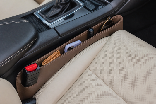 Car seat gap filler installed securely between a front vehicle seat and the center console with the seat belt buckle unobstructed