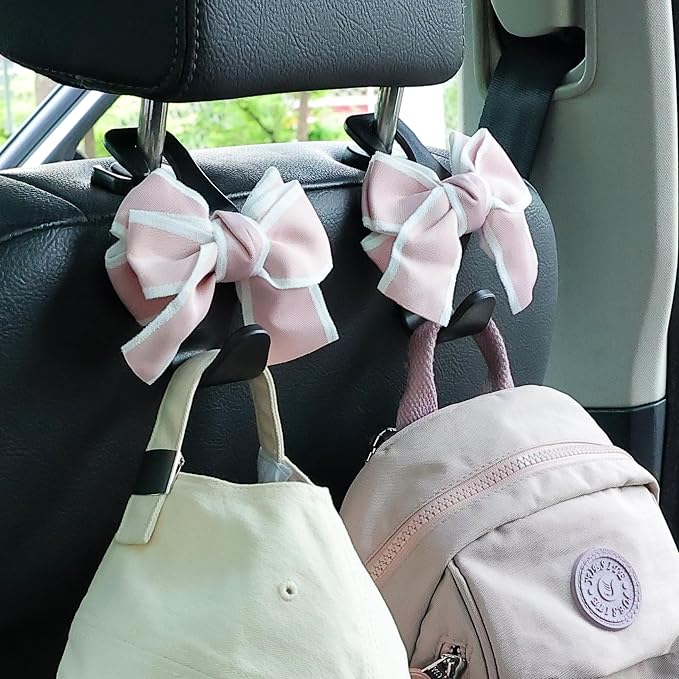 Amooca Car Seat Headrest Hook Cute Bowknot Vehicle Hanger Car Storage Organizer for Handbag Purse Coat Grocery Bag Black Pink